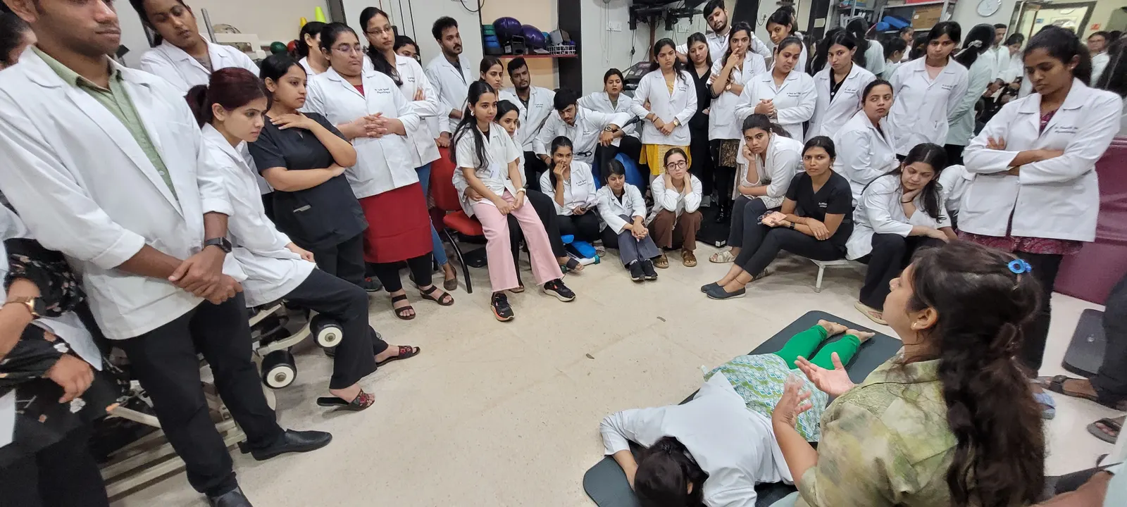 A clinical lecture and hands-on demonstration to an audience of physiotherapists